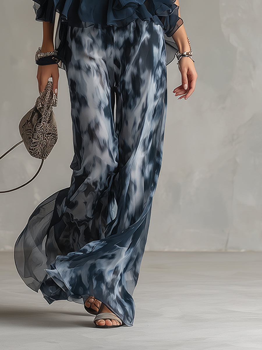 Celestina | Elegante conjunto de gasa con top halter azul marino urbano y pantalones anchos estampados.