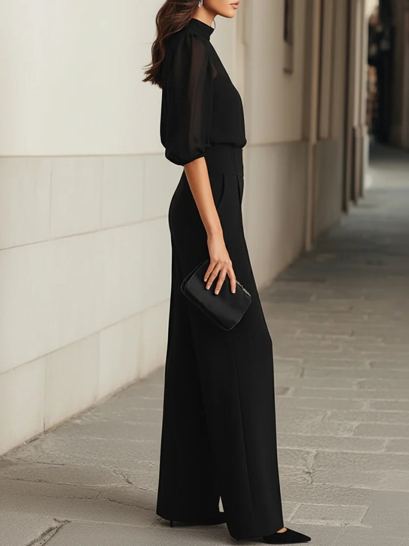 Valentina • Conjunto de tres piezas en negro, compuesto por un top camisola transparente y unos pantalones de pierna ancha