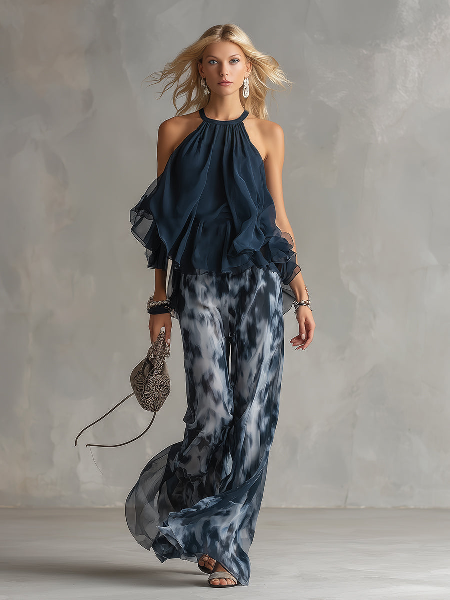 Celestina | Elegante conjunto de gasa con top halter azul marino urbano y pantalones anchos estampados.