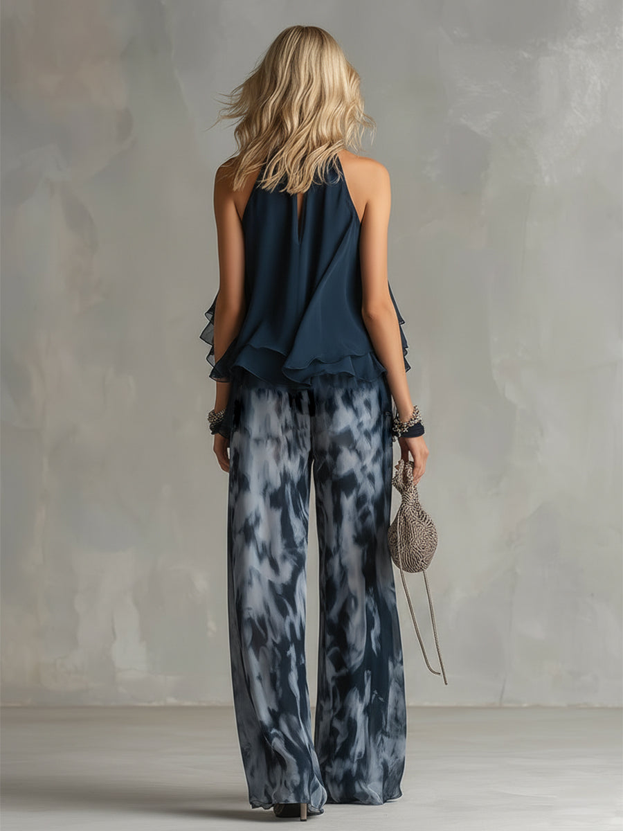 Celestina | Elegante conjunto de gasa con top halter azul marino urbano y pantalones anchos estampados.